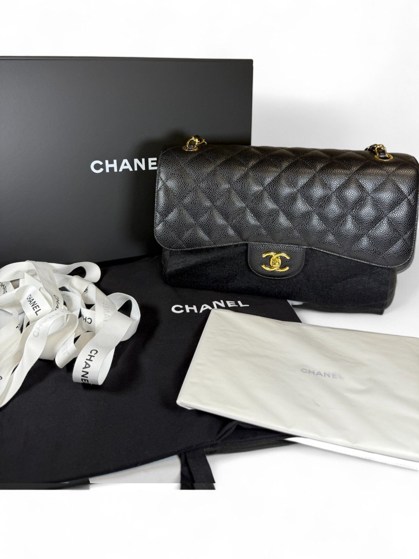 CHANEL-Large Quilted Caviar Double Flap Bag | Retail Price: $11,680