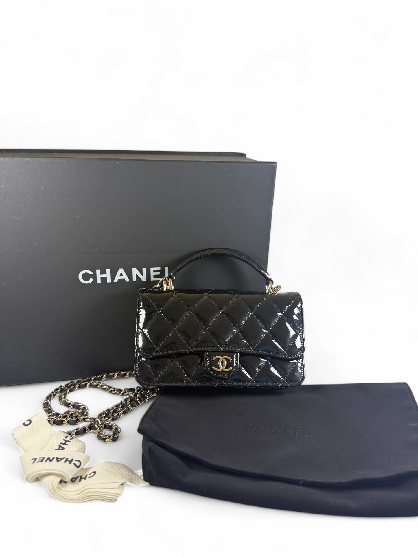 Chanel Black Patent Leather Mini Top Handle Flap Bag – Retail Price: $6,100