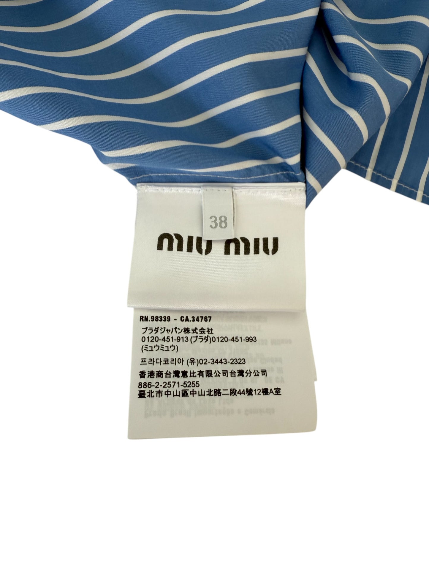 Miu Miu Sleeveless Striped Logo Turtleneck Top – Retail Price: $1,190 USD